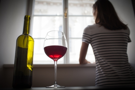 Woman drinking a glass of wine